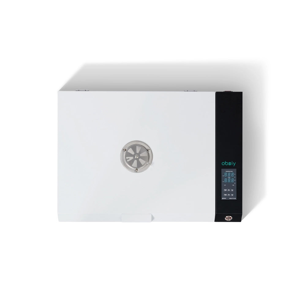 Top-down view product image of the Obziy DTF Oven showing the digital control panel and user interface (UI). The white oven lid features a central silver fan vent. The black panel on the right displays three red digital readouts and several control buttons beneath the