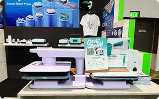 Obziy heat press booth at IFA trade show, demonstrating compact and efficient heat transfer technology
