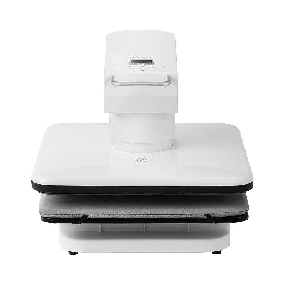 Front view of a white, modern automatic press machine (brand appears to be "obziy"). It features a square lower pressing plate with a grey cloth pad and a vertical top section containing a digital control panel and handle.